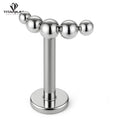 Kolczyk labret z nakrętką złożoną z kuleczek ułożonych w łuk