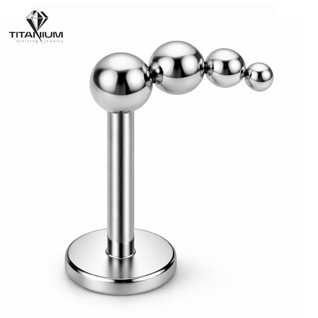 Tytanowy labret z czterema kuleczkami w kolorze srebrnym