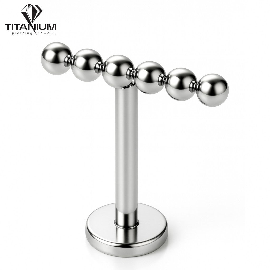 Tytanowy Labret z nakrętką z kuleczek ułożonych w rzędzie